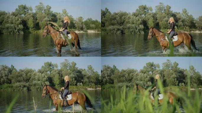 特写: 度假的女人在草木河岸的水中骑马