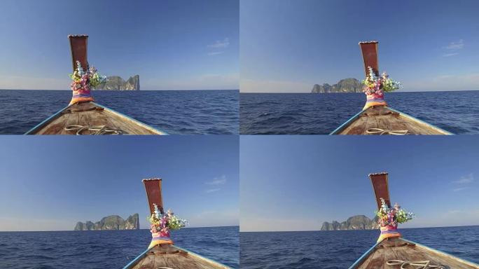 POV: 在阳光明媚的下午，乘坐木制长尾船驶向石灰岩小岛。