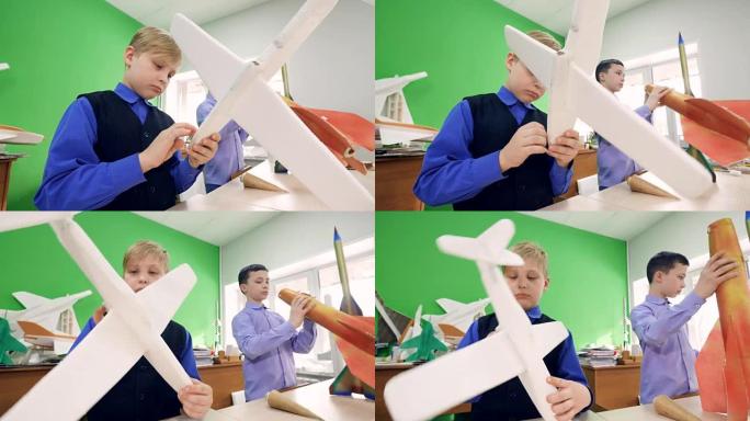 小学生组装飞机的构造模型和火箭的模型。4K。
