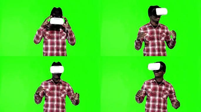 非洲男子在绿屏上佩戴VR google