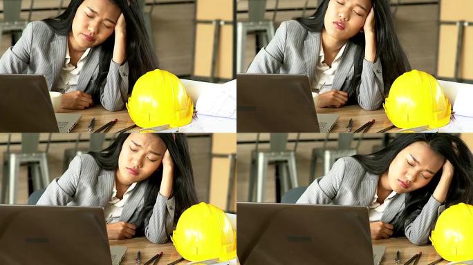 职业女性工程师因为努力工作而昏昏欲睡。