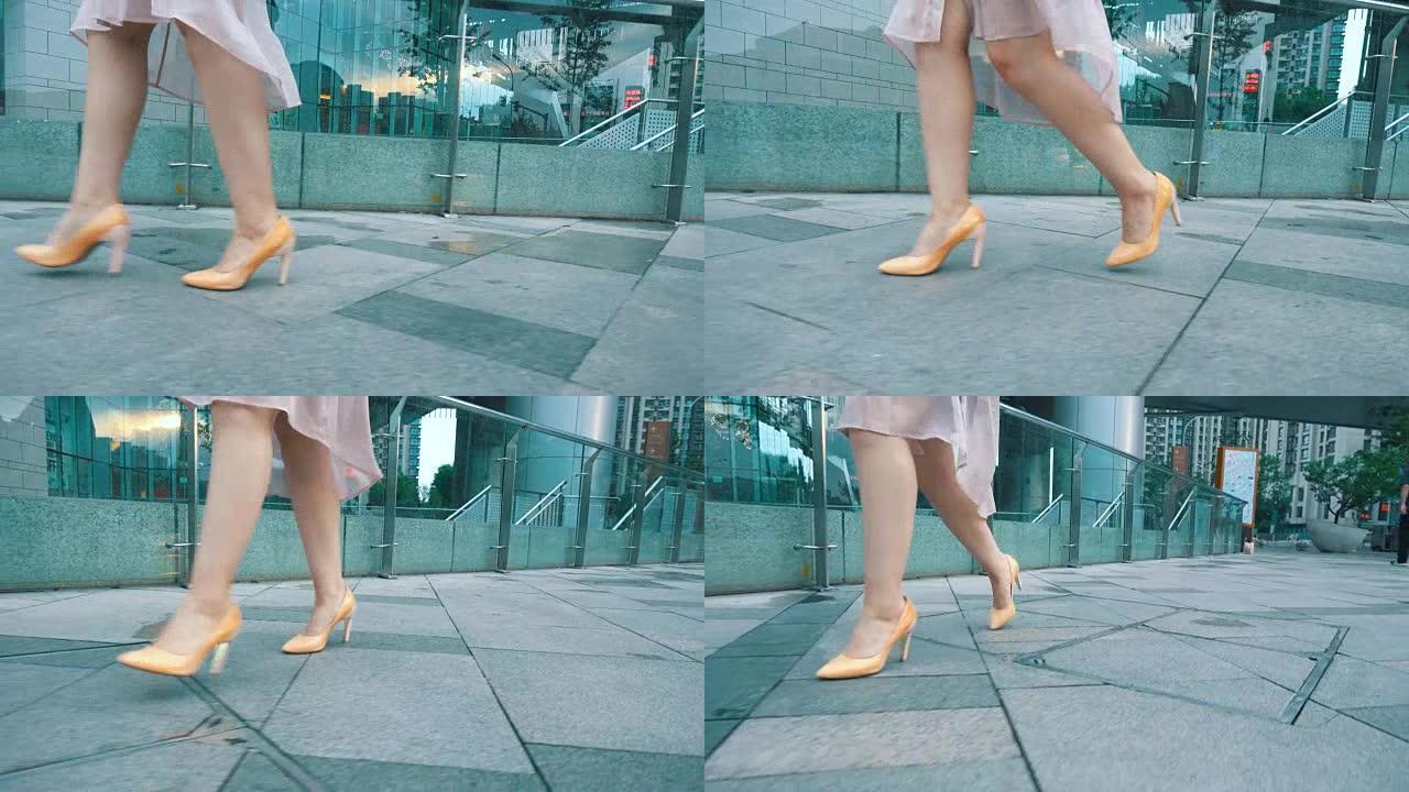 穿着高跟鞋走路的女人的腿