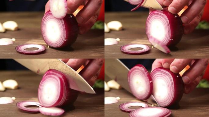 厨师用刀将红洋葱切成薄片