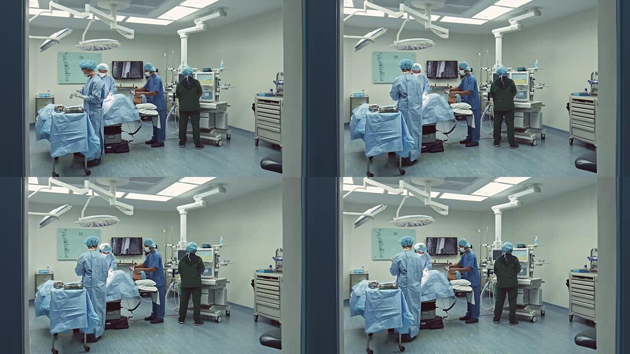 医疗队在医院手术室操作一名病人