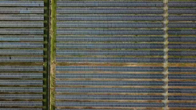 日落时太阳能发电所的鸟瞰图，无人机拍摄