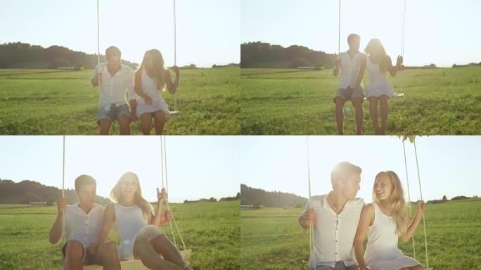 慢动作特写: 轻声的年轻夫妇在阳光的大自然中分享一个笑话