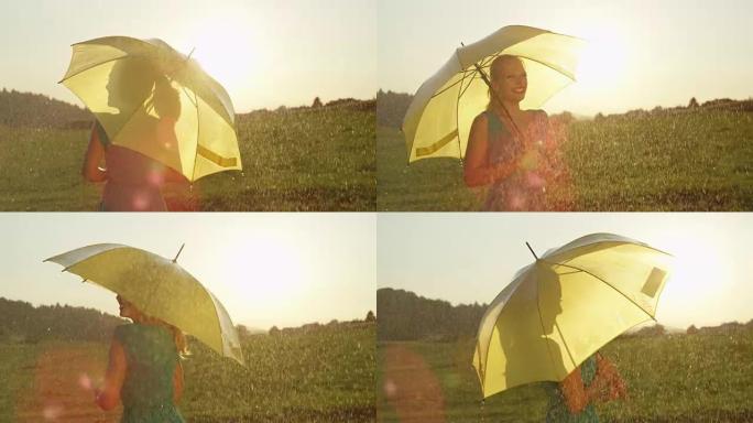 慢动作: 开朗的金发女孩在黄色的雨伞下在雨中跳舞。