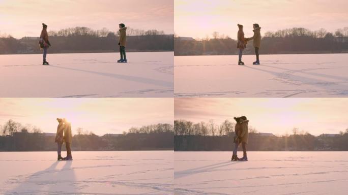 4k浪漫情侣在阳光明媚的冰冻湖上滑冰接吻，慢动作
