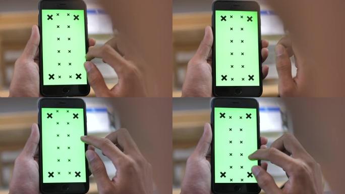 使用智能手机的特写，绿屏
