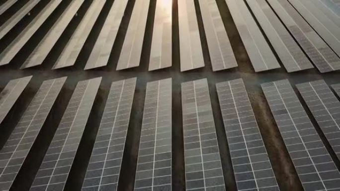 日落时太阳能发电所中的太阳能电池板