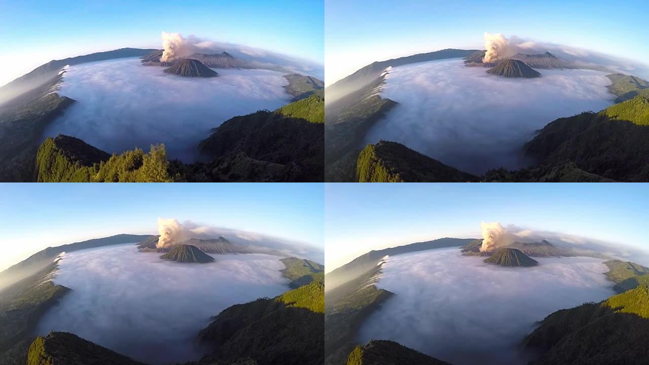 在日出时飞过布罗莫火山，位于印度尼西亚东爪哇的布罗莫腾格里国家公园的布罗莫火山的壮丽景色。
