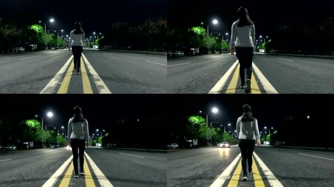 年轻女子晚上独自走在街上