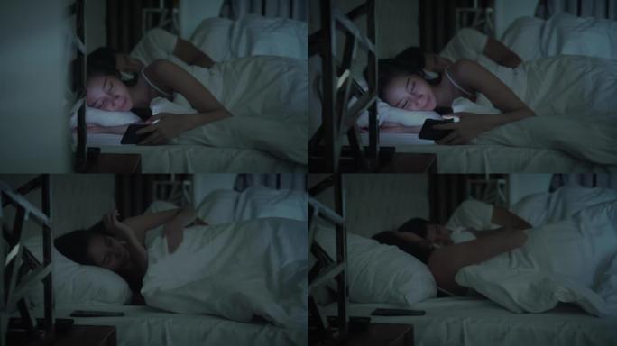 妇女在床上使用智能手机，多莉开枪