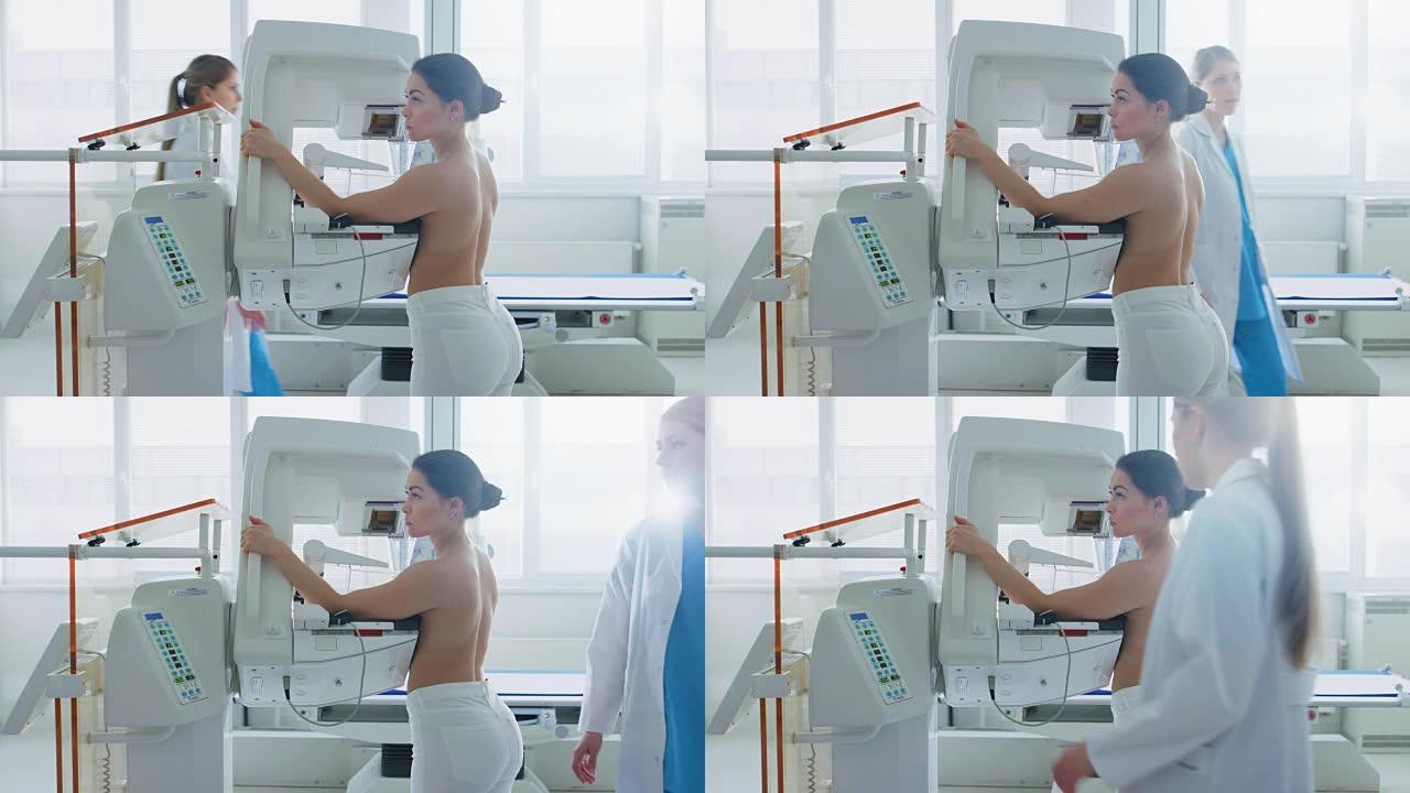 在医院里，正在接受乳房x线筛查的半裸女性病人的侧视图。健康年轻女性进行癌症预防性乳房x线摄影扫描。拥