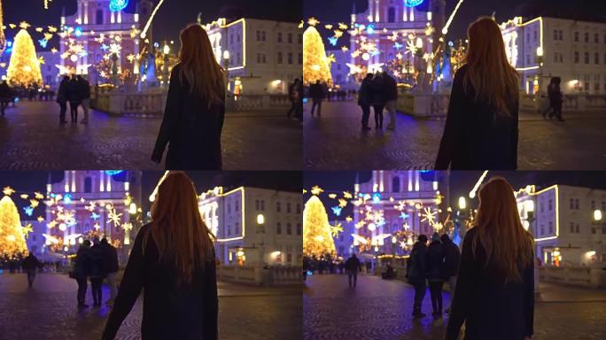 晚上在斯洛文尼亚卢布尔雅那探索圣诞节的游客
