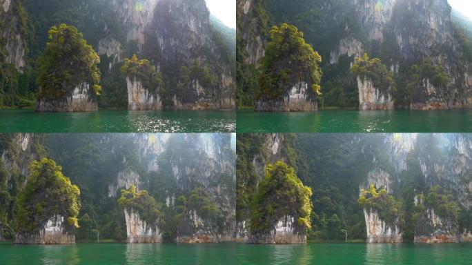 从泰国考索克国家公园内的Cheow Lan湖著名的 “三姐妹” 喀斯特岩层的水中观看