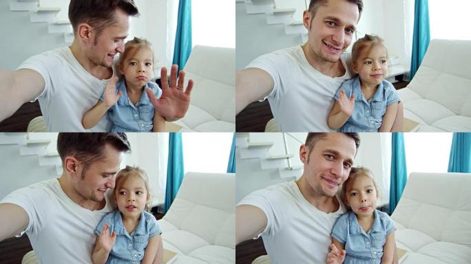快乐的父亲和小女孩向镜头挥手