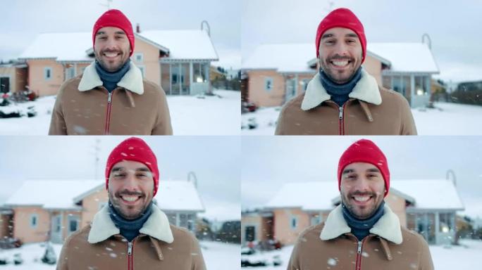 一个美丽的冬日，英俊的男人在后院散步的肖像。软雪落下。