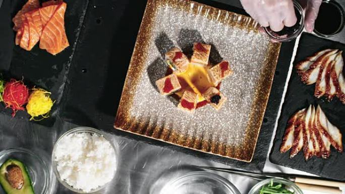 餐厅厨师用鱼子酱装饰寿司