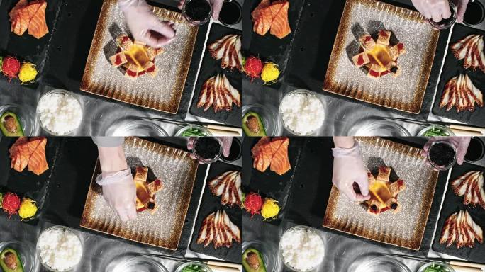 餐厅厨师用鱼子酱装饰寿司