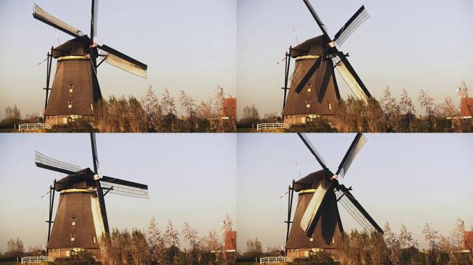 4k传统的荷兰乡村风车工作。荷兰。欧洲历史地标。农场磨坊纺纱缓慢