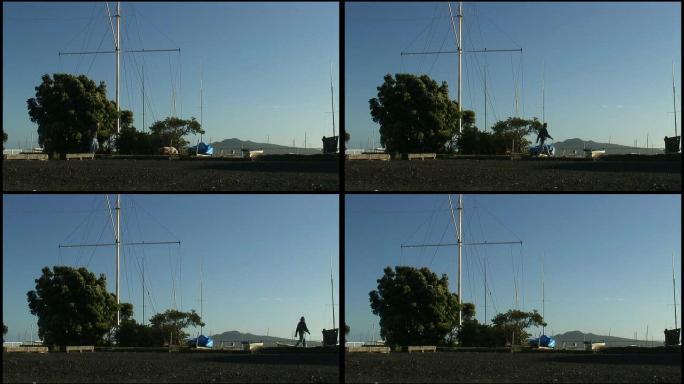 （HD1080）男子在桅杆和火山前遛狗