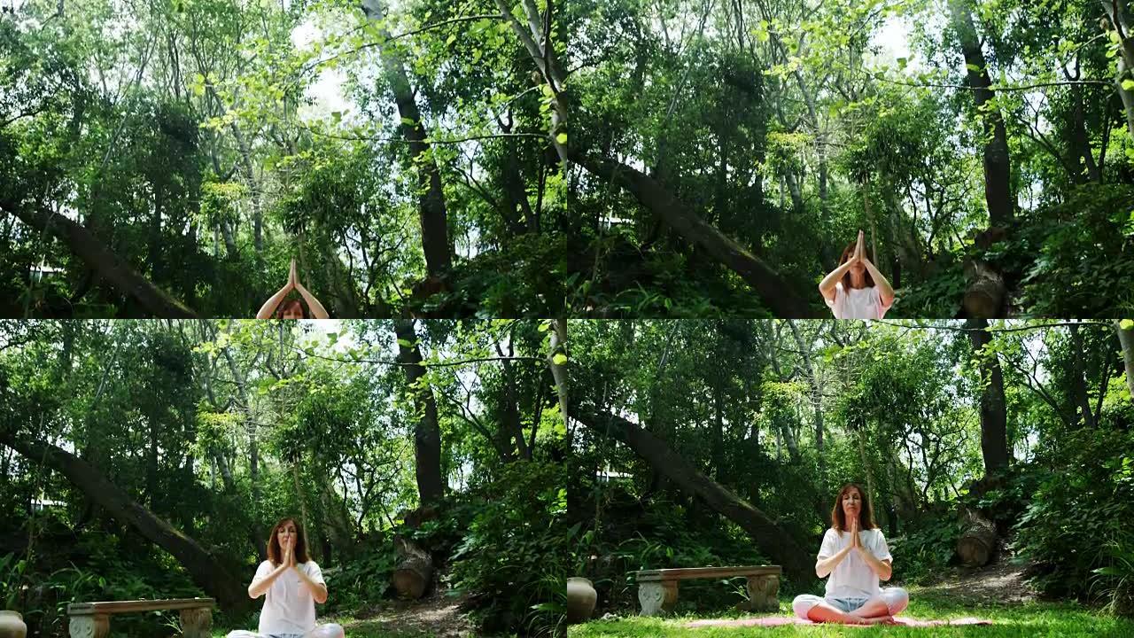成熟的女人在公园表演瑜伽4k