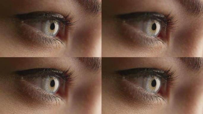 女人张开蓝眼睛聚焦视线的特写镜头。