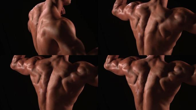 男性健美运动员弯曲肌肉，后视图