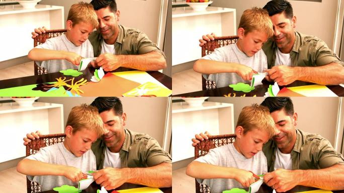 父亲和儿子在餐桌上一起制作纸质形状