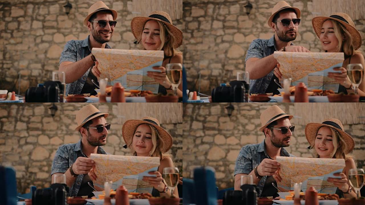 游客在欧洲乡村餐厅阅读地图和规划路线