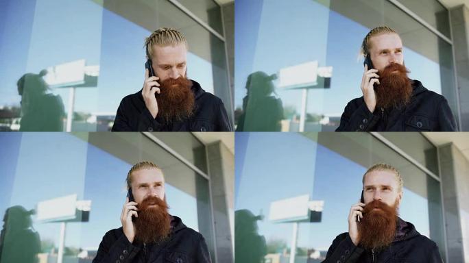 年轻的大胡子潮人集中在citystreet的电话上聊天，并在办公楼附近交谈