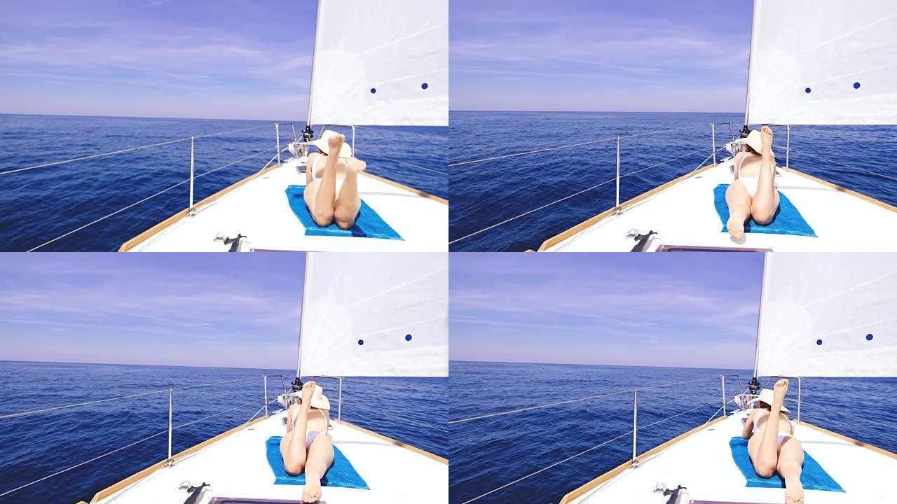 在帆船甲板上享受日光浴的DS女人