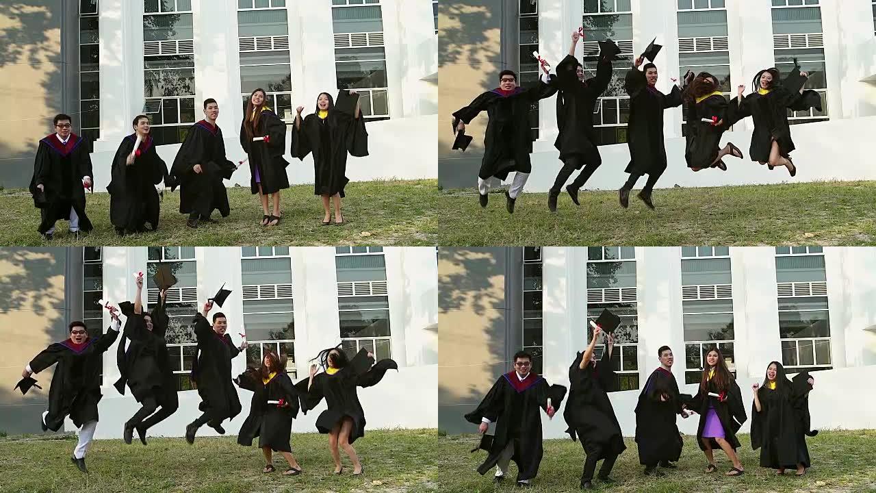 穿着学术服装的成功毕业生拿着文凭，看着相机，微笑着在户外跳跃拍照。