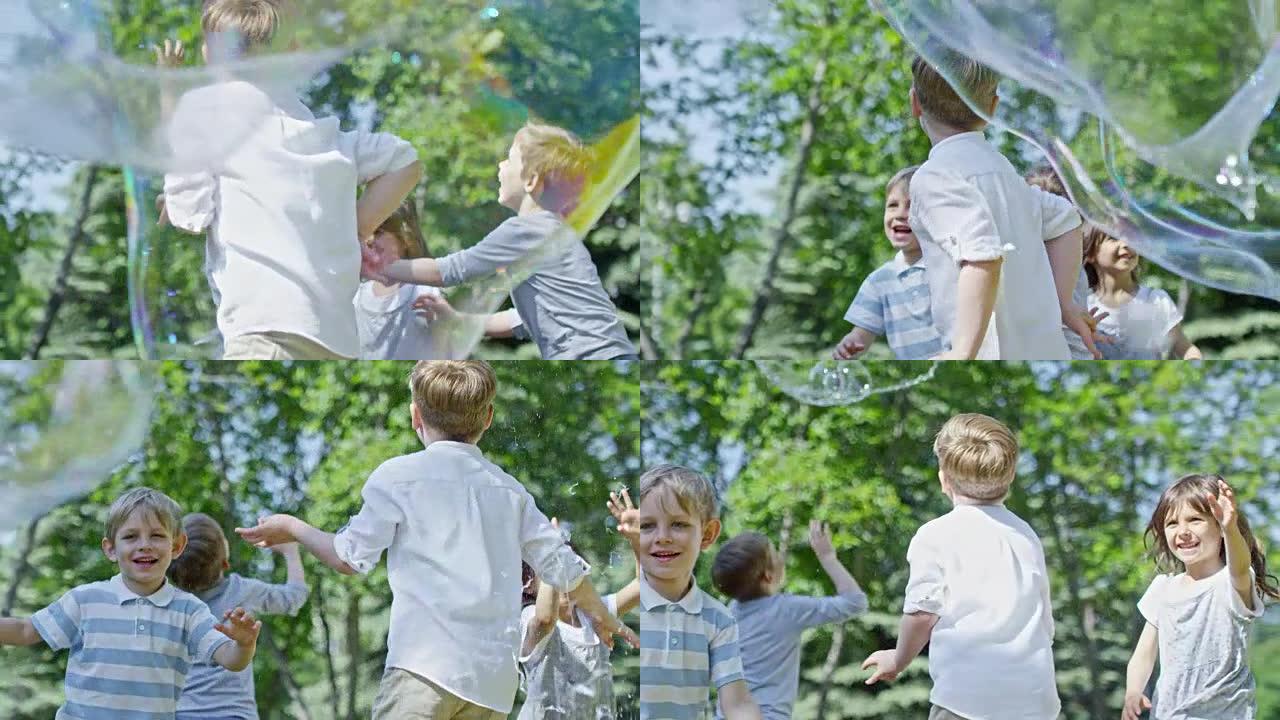 兴奋的孩子在公园里捕捉泡泡