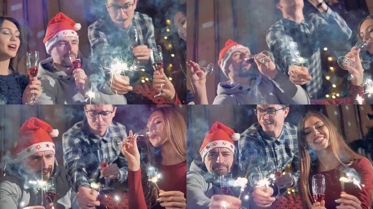 用葡萄酒和烟火庆祝圣诞节的人们的特写镜头。
