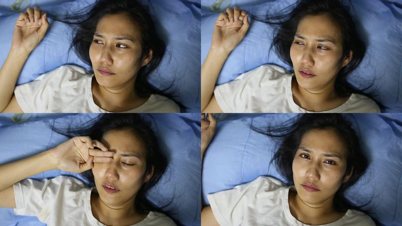 亚洲女人在床上哭泣