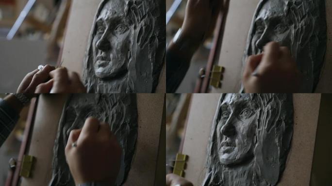 雕塑家在艺术工作室的画布上创作女性脸部雕塑的特写