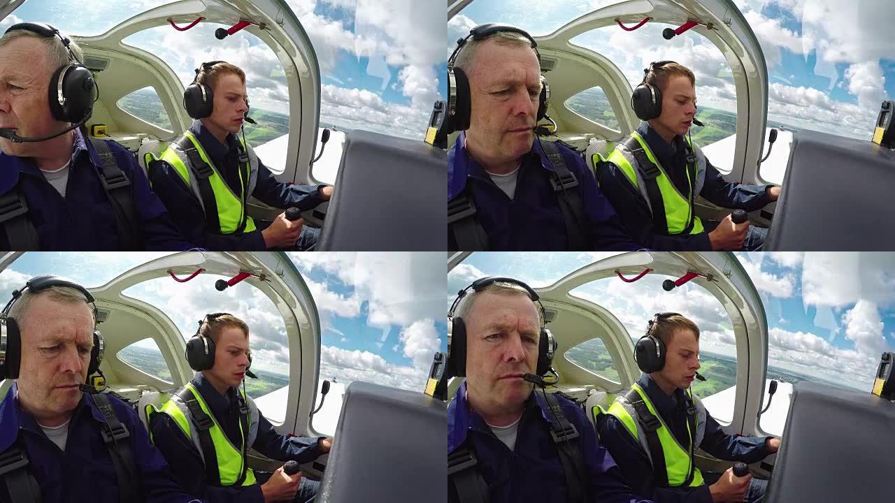 飞行教练指导学生进行空中练习