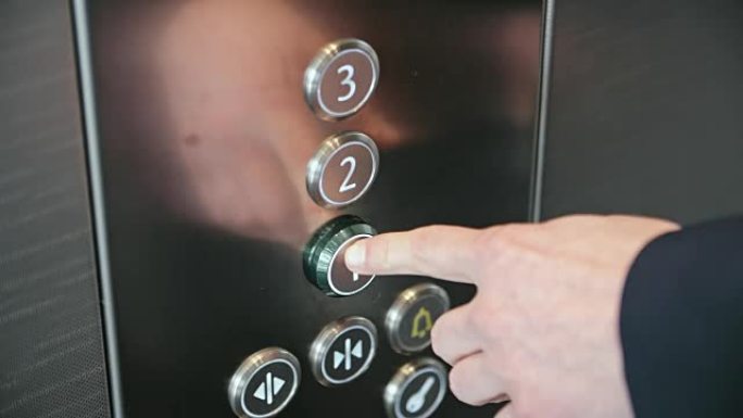 按下电梯按钮特写镜头不锈钢面板点击按压