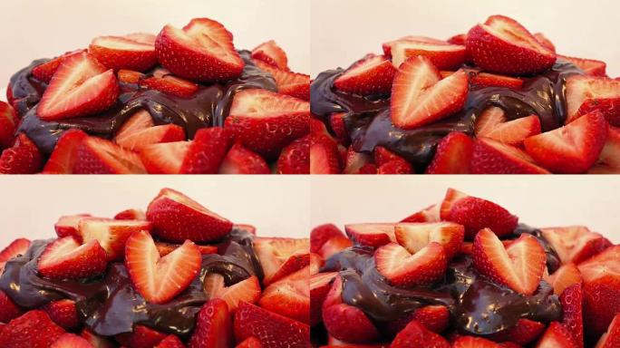 草莓和融化的巧克力旋转