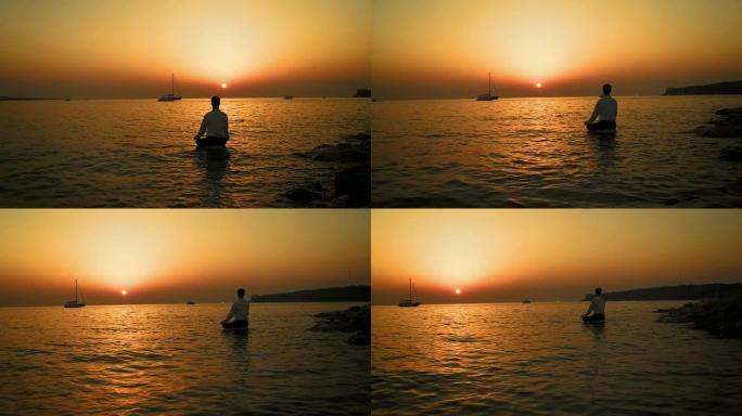 高清: 日落时在海中冥想