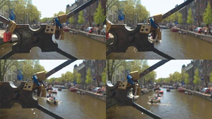 Dop: 拥挤的市中心运河上方的旧桥上的彩色lovelocks