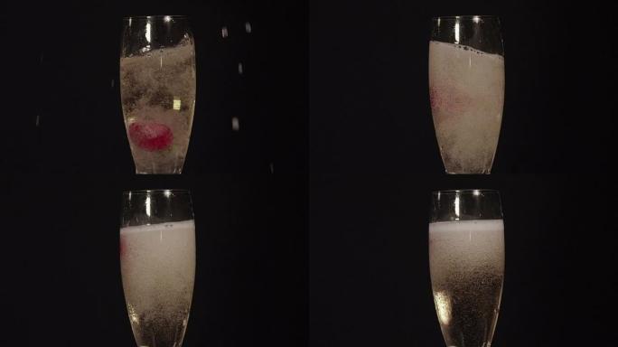 慢动作特写: 草莓掉进香槟