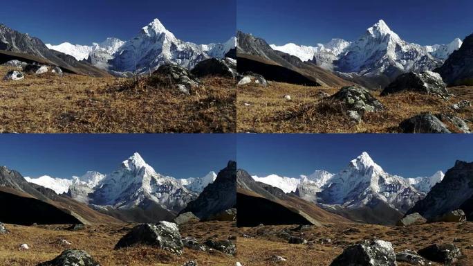 高高的岩石雪山在晴朗的天空下。万向节稳定射击。尼泊尔萨加玛塔国家公园Ama Dablam山。4K, 