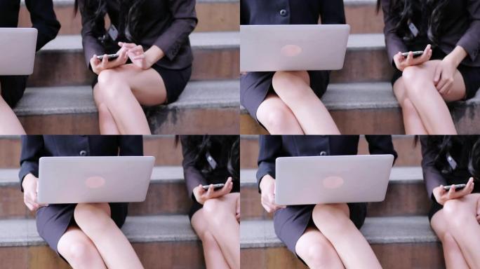 4K: 女商人在笔记本电脑上工作，以便在户外工作。
