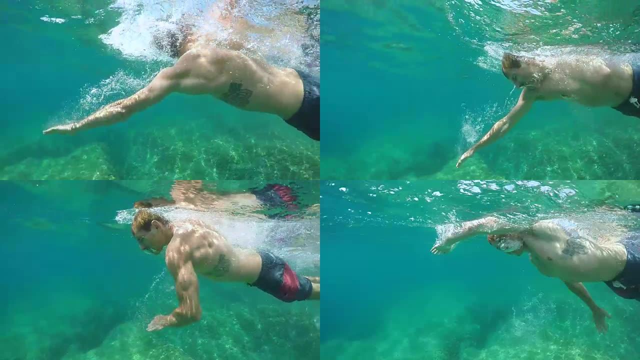 水下: 运动型家伙在美丽的翡翠海洋中闭着眼睛游泳爬行