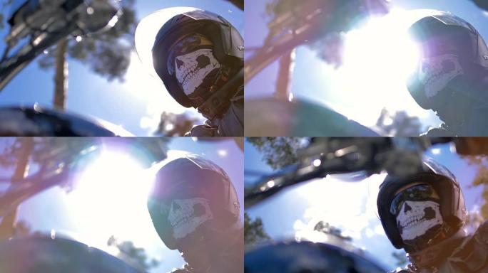 戴着头盔坐在摩托车上的肖像摩托车手。