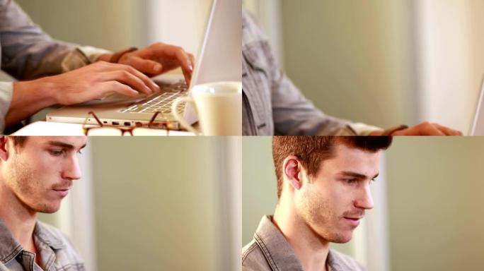 微笑的休闲商人在笔记本电脑上打字