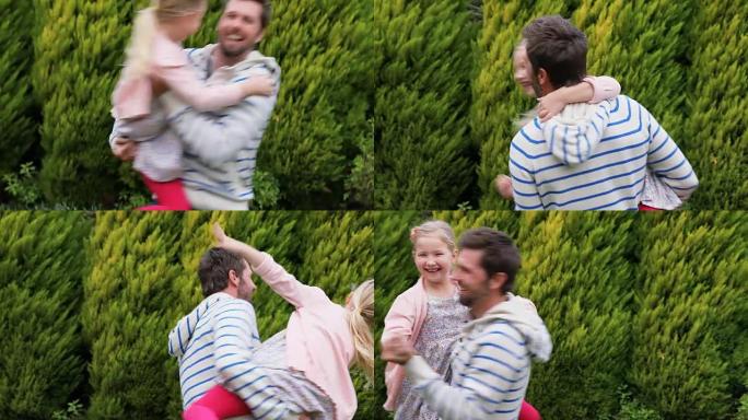 父亲举起女儿在花园里跳舞4K 4k